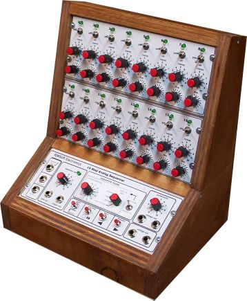 A finished MFOS 16 Step Sequencer in a wooden console case with a sloped front. The upper section holds two rows of eight steps, each step with a toggle switch, a small LED and two red knobs for coarse and fine. The lower angled panel, labeled MFOS Electronic Music, 16 Step Analog Sequencer, holds the jacks, the sequence rate and portamento knobs, the mode selector and four round pushbuttons.