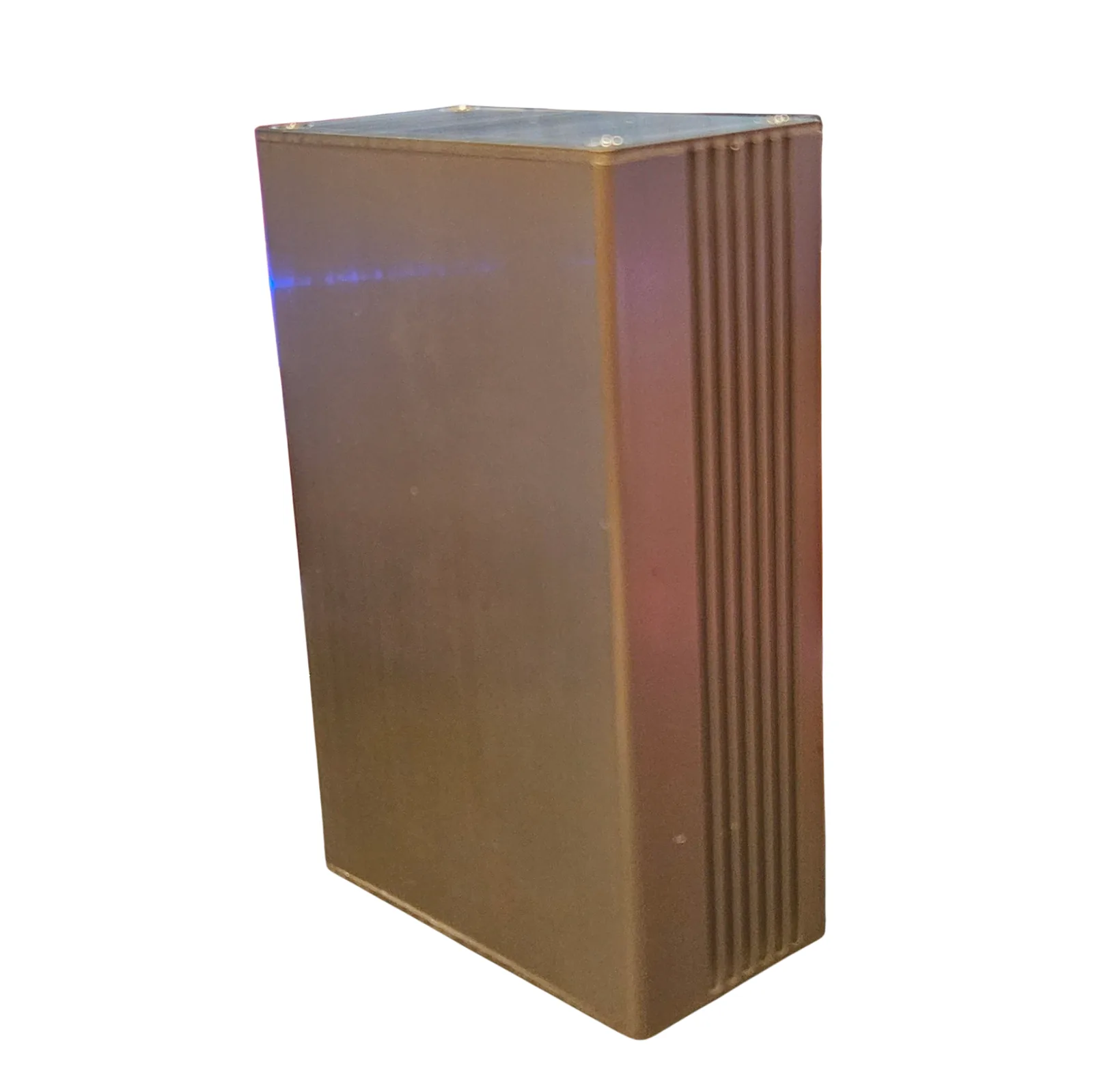 The back of The Button, an upright brushed aluminum box against white: a plain flat panel with a ridged strip down one edge and nothing else on it.
