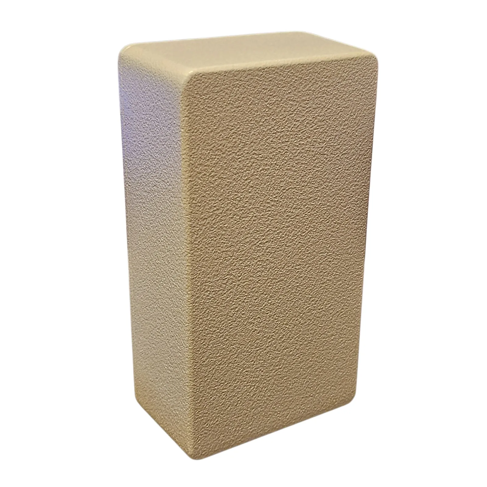 The Groaner itself, an upright sand-colored aluminum box with a coarse textured finish against white, seen from the front and slightly above. The face is completely plain: no lettering, no controls, no holes.