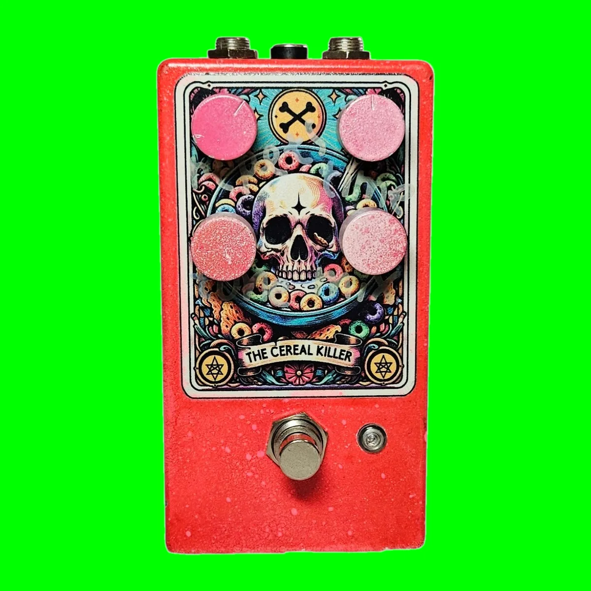 The Cereal Killer pedal - red speckled enclosure with four dusty pink knobs and tarot-card skull-in-a-cereal-bowl artwork