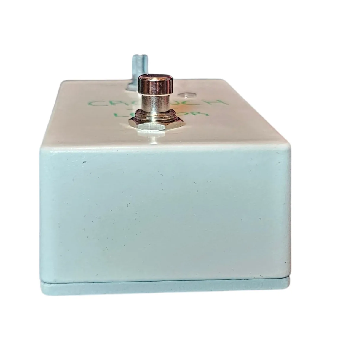 Cronch-u-lator pedal, top-edge view looking down at the 1/4-inch input and output jacks on the top of the enclosure.