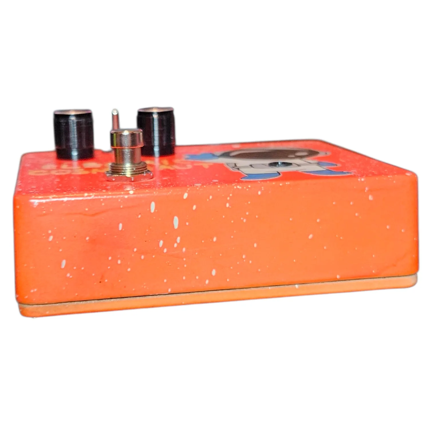 Top-down view of the wide enclosure: the top edge carries a 1/4-inch jack near each end with a DC power jack between them, and "OUT" engraved beside the right-hand jack. "BLEND" is engraved above the small toggle switch with "DECAY" to its right, above the two ribbed cream knobs.