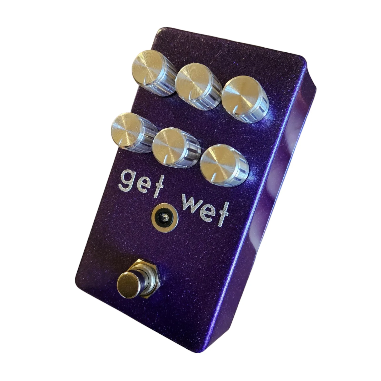 Get Wet pedal, angled view from the right with the right side of the enclosure catching the light, the six chrome knobs, the get wet lettering, the LED and the footswitch.