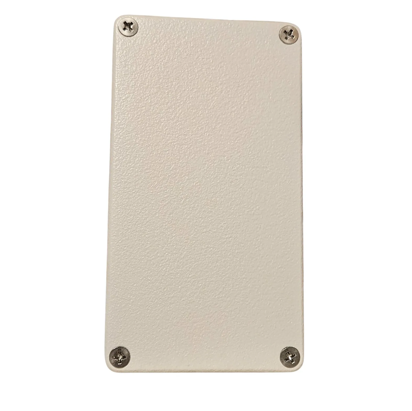 The back of the box: a plain off-white plate with a Phillips screw in each corner and nothing else on it.