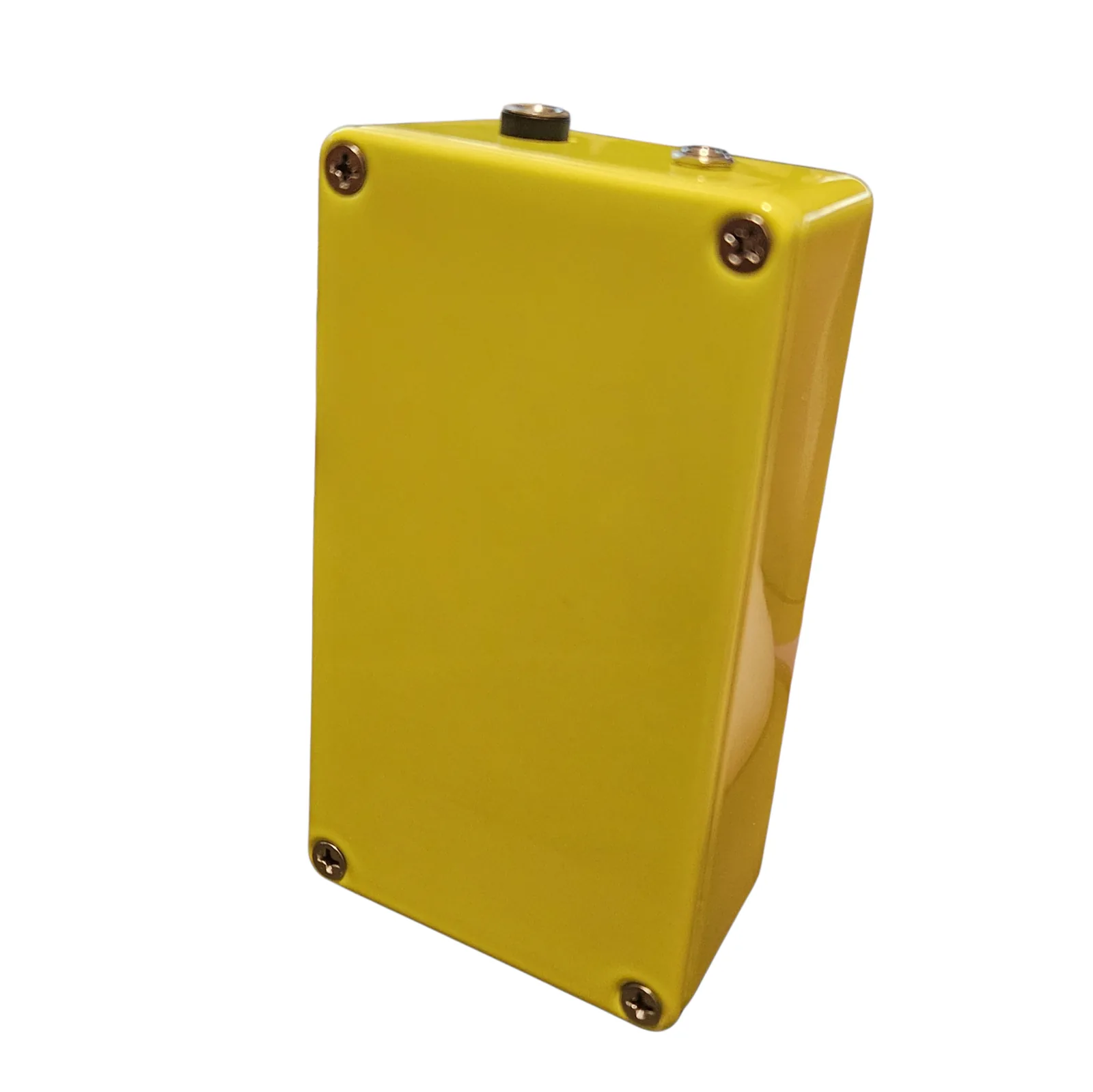 The back of the box: a plain neon green plate with a Phillips screw in each corner, and the two jacks visible along the top edge.