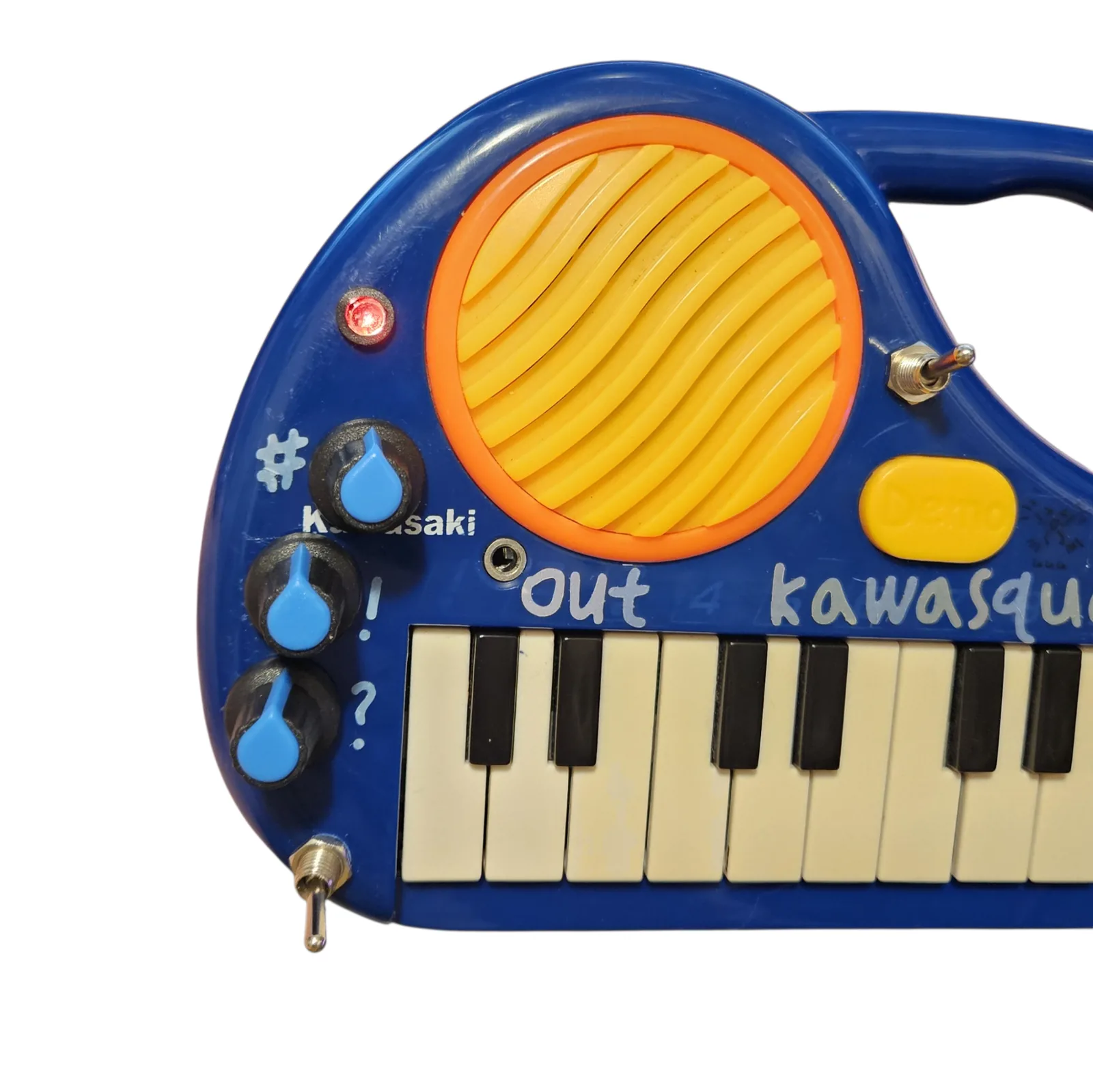 The left end of the panel with the recorder switched on. A small indicator above the knobs glows red, the toggle beside the speaker is flipped up, and the three black knobs with their blue teardrop pointers and their asterisk, exclamation mark and question mark labels are below.