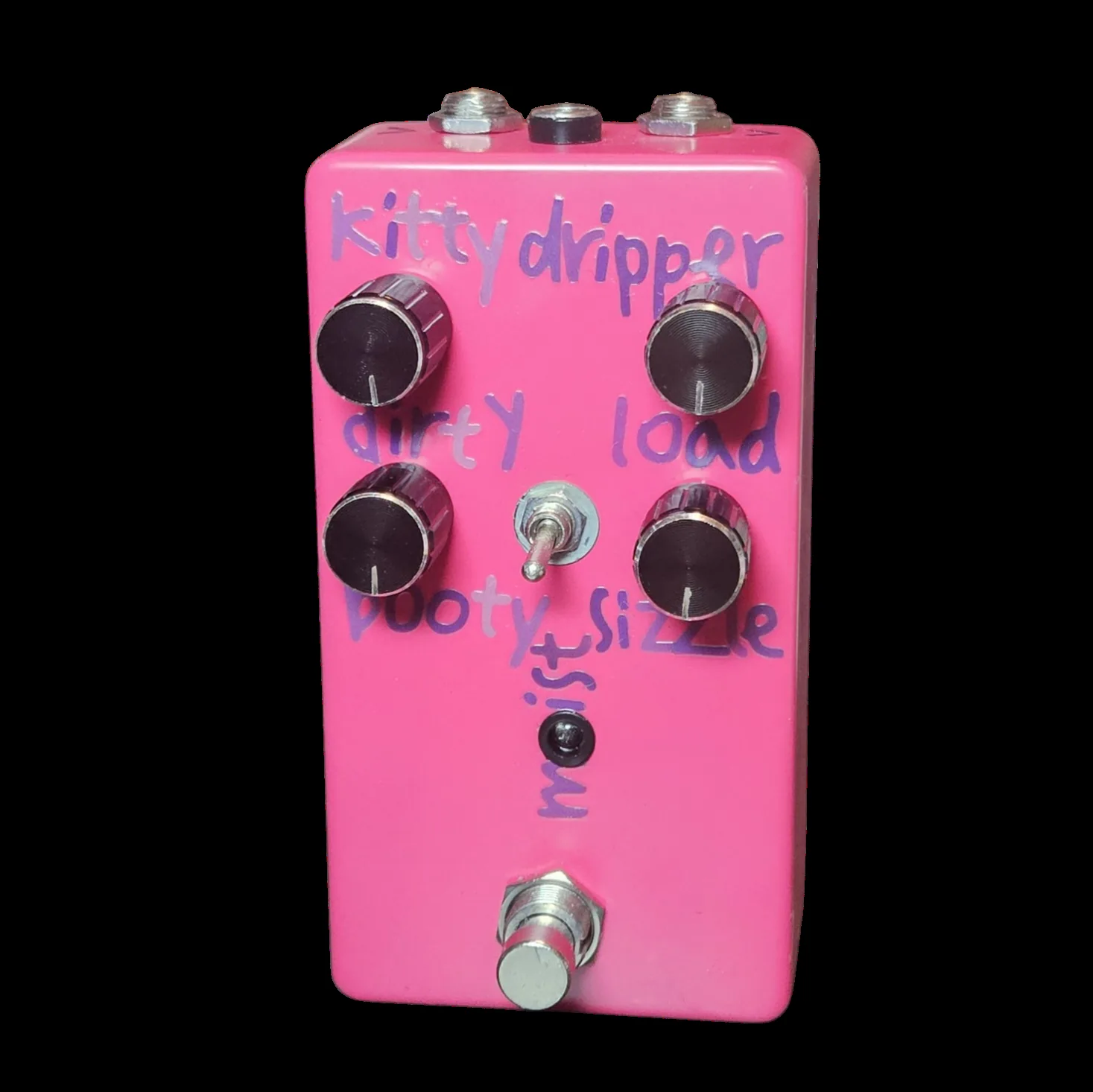 A hot pink pedal photographed face on. The words kitty dripper are hand-lettered across the top in purple marker. Four black knurled knobs sit in two rows, marked dirty and load along the top and booty and sizzle below. Between the lower two knobs is a small silver toggle switch with the word moist written up its side, and under that a black LED and a silver footswitch. Three jack nuts show along the top edge.
