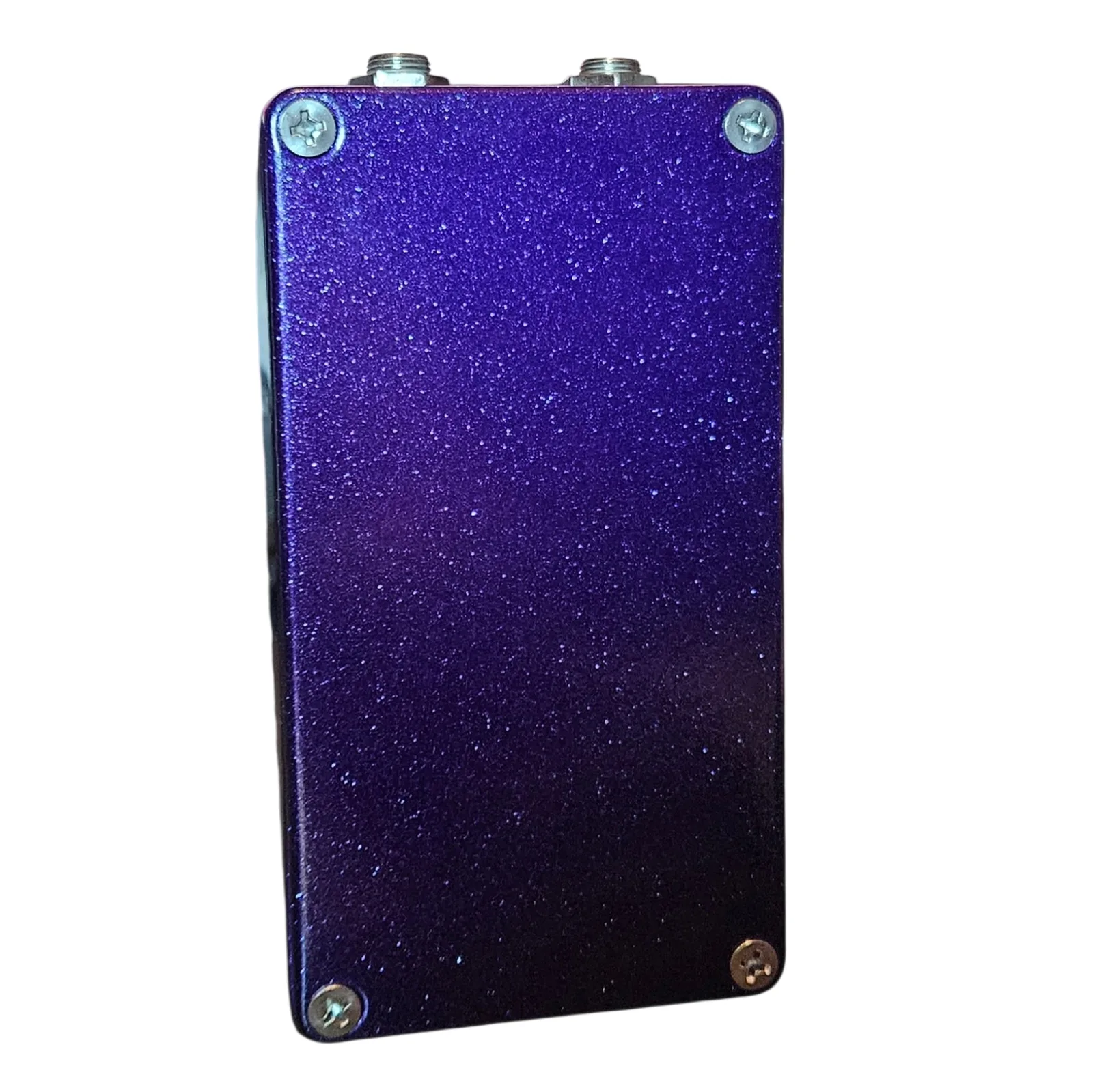 Mr. Ownz pedal, back view showing the metallic-purple-glitter bottom plate with four corner Phillips screws and no label.