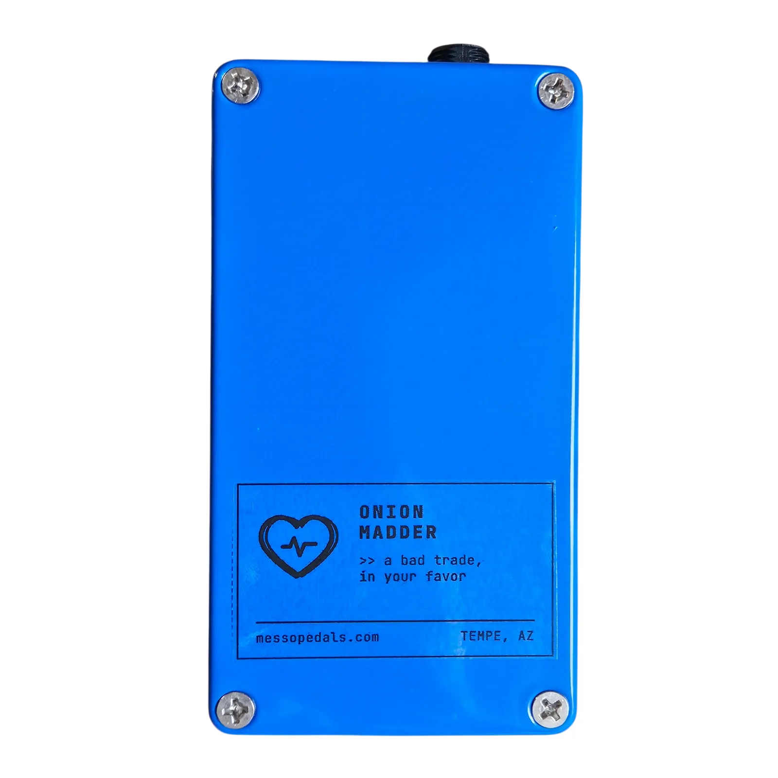 The back of the blue box: a Phillips screw in each corner and a printed label along the bottom with a heart logo, reading Onion Madder, a bad trade, in your favor, messopedals.com, Tempe, AZ.