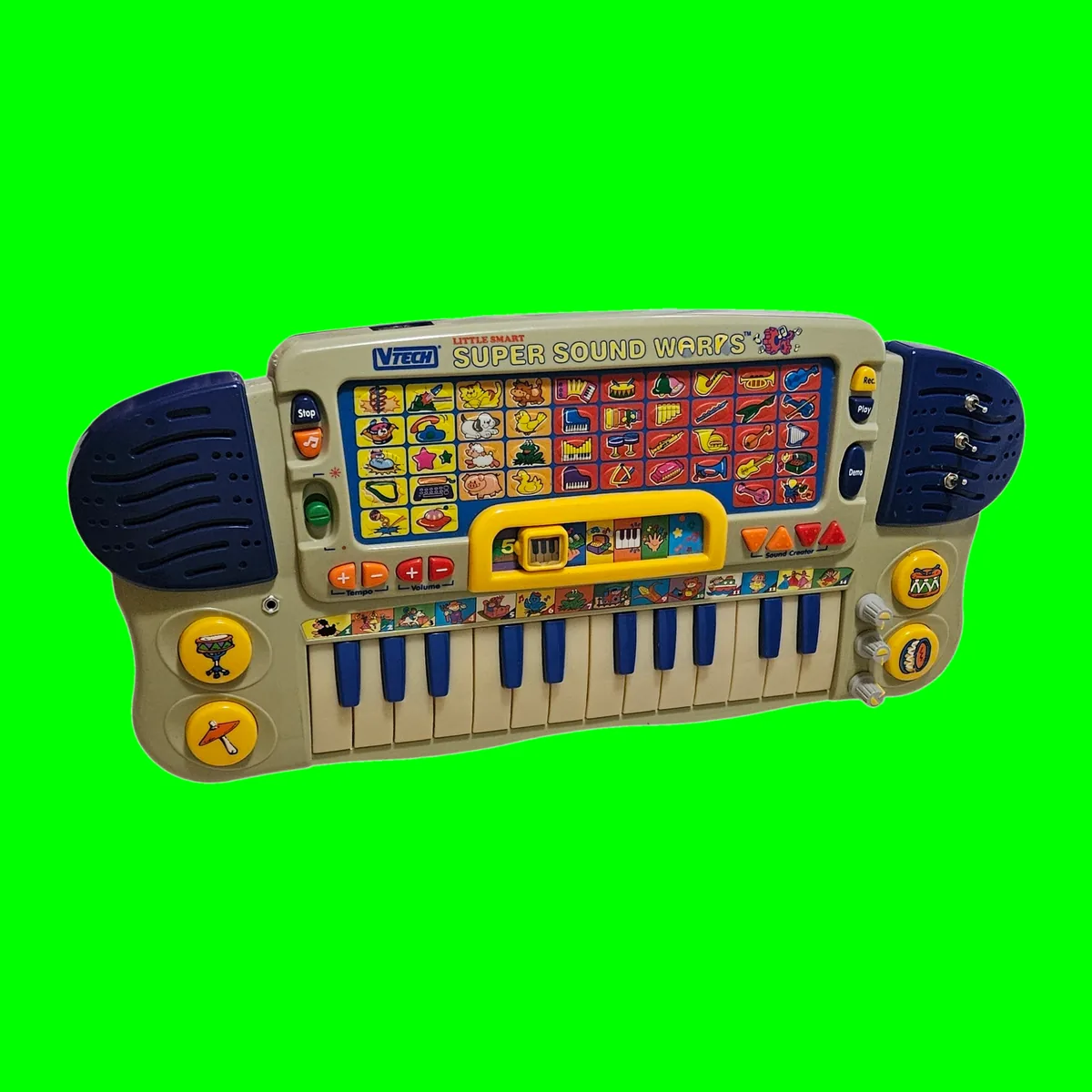 Super Sound Warps - a cream 1996 VTech toy keyboard with dark blue speaker grilles and blue and cream keys, with three added toggle switches set through the right speaker grille and three small knobs down the right edge