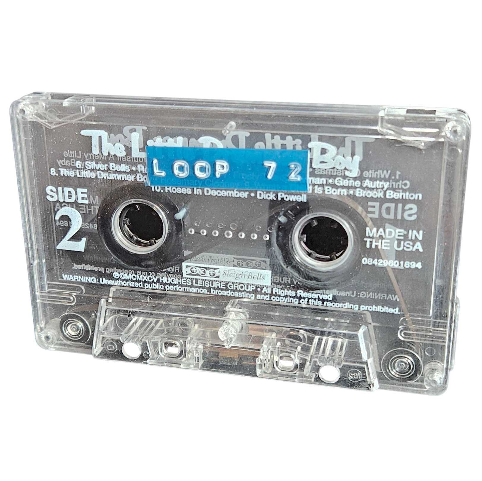 Clear cassette shell labeled Loop 72 on a blue strip, recycled from a Little Drummer Boy Christmas compilation