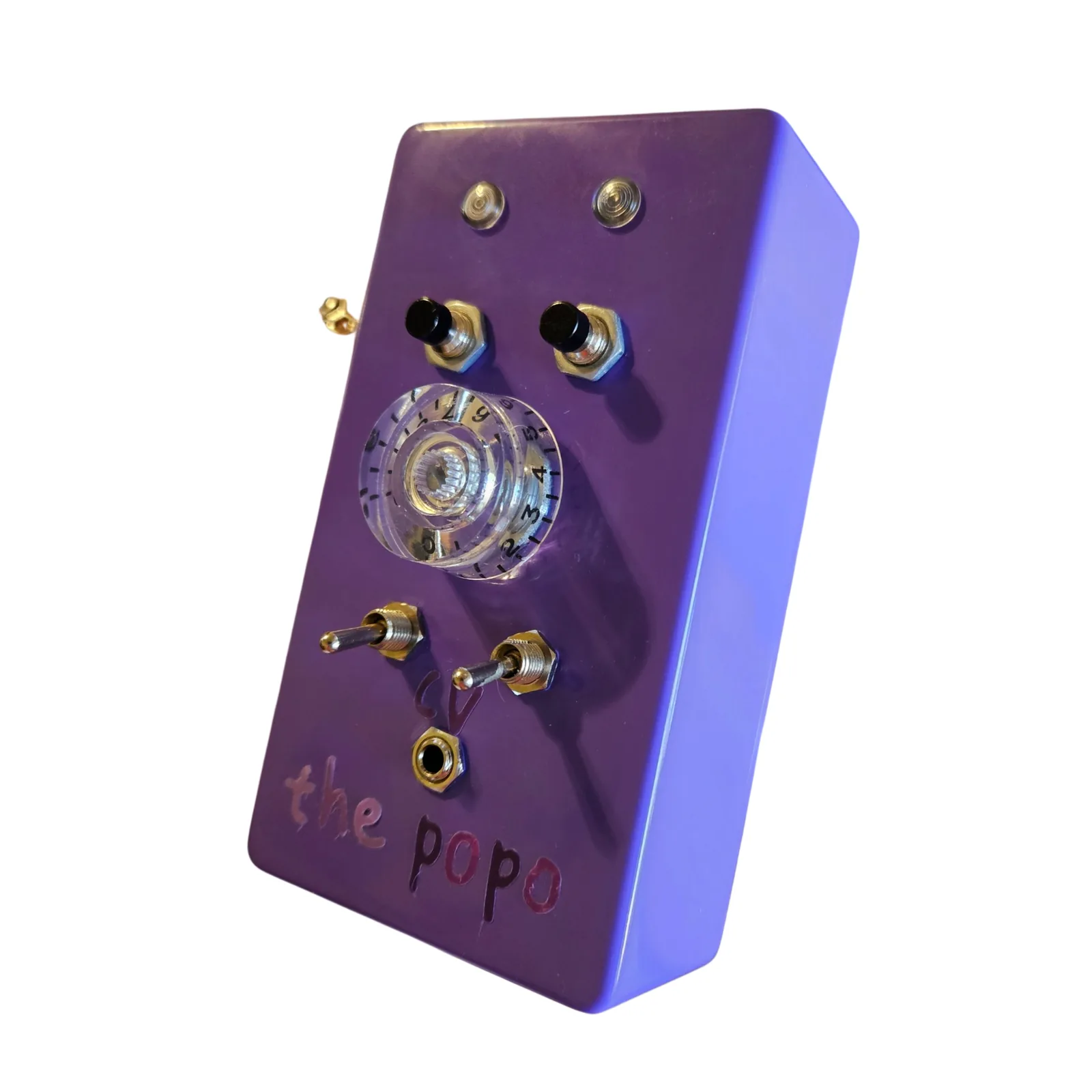 The Popo from the right at a three-quarter angle, the purple right side toward the camera, with the clear knob and the popo lettering on the face.